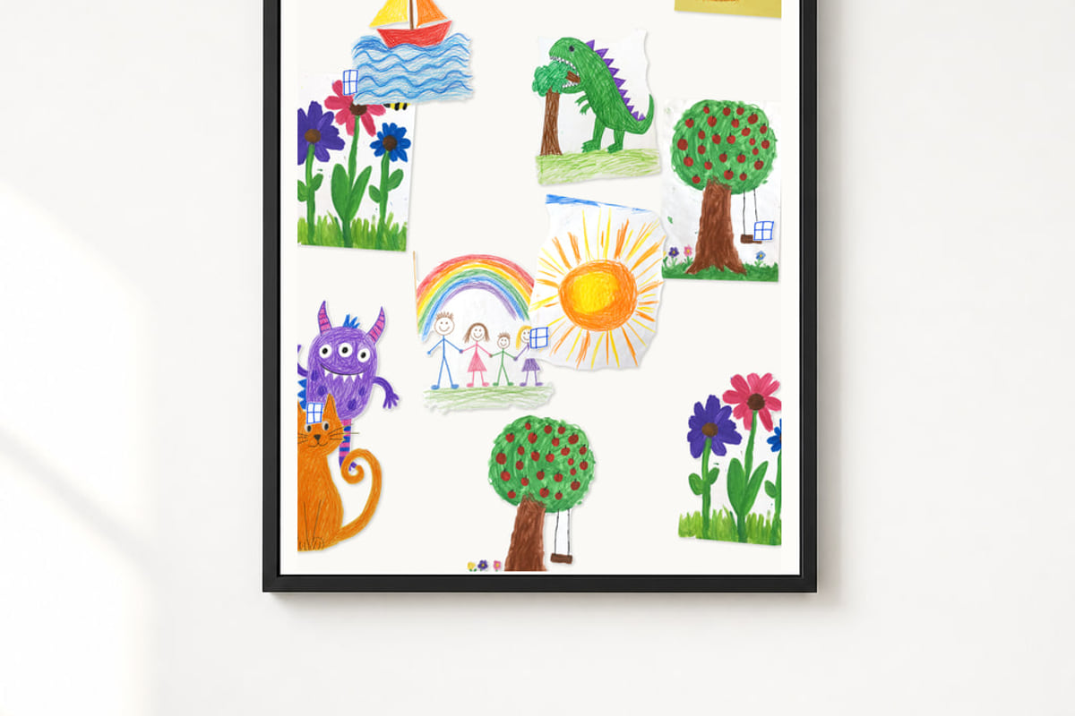 The finished piece in a black frame on a white wall.